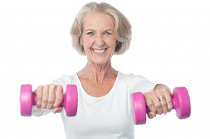 Older woman holding weights